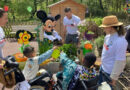 Mickey Mouse at Disney Hotel Cheyenne with kids from Secours Populaire français for Earth Month